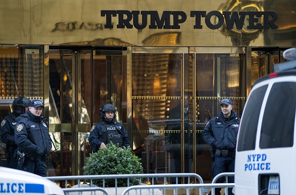 New York City police stand guard in front of Trump Tower, a residence of President-elect Donald Trump in New York, Sunday, Nov. 13, 2016. (AP Photo/Craig Ruttle)
